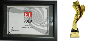 Framed certificate and gold trophy on a black background